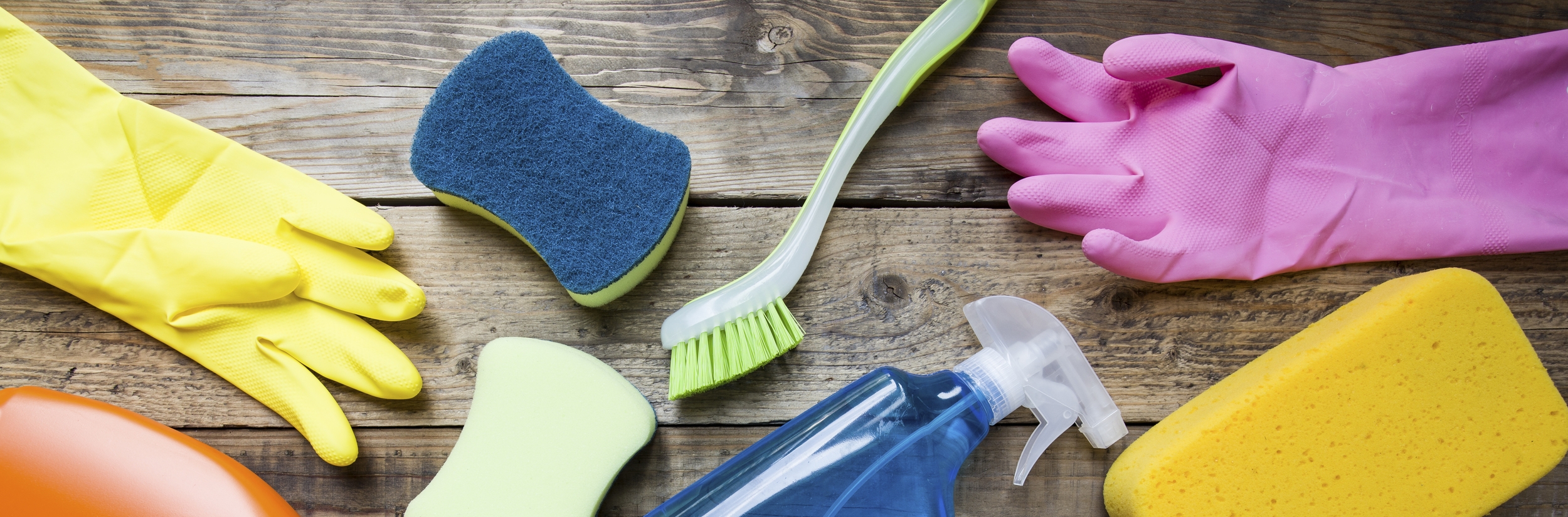 Picture of rubber gloves and cleaning supplies.