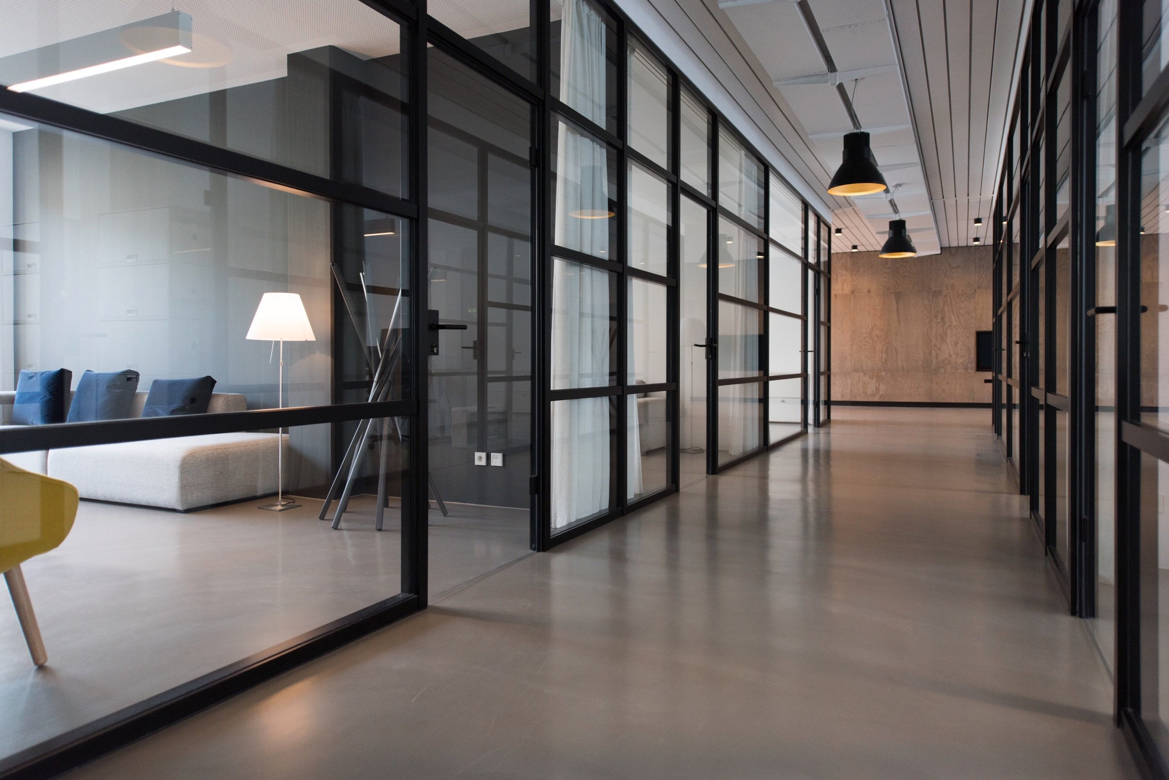 Picture of a large office with different rooms.